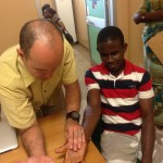 Hand surgeon with Patient in Ghana