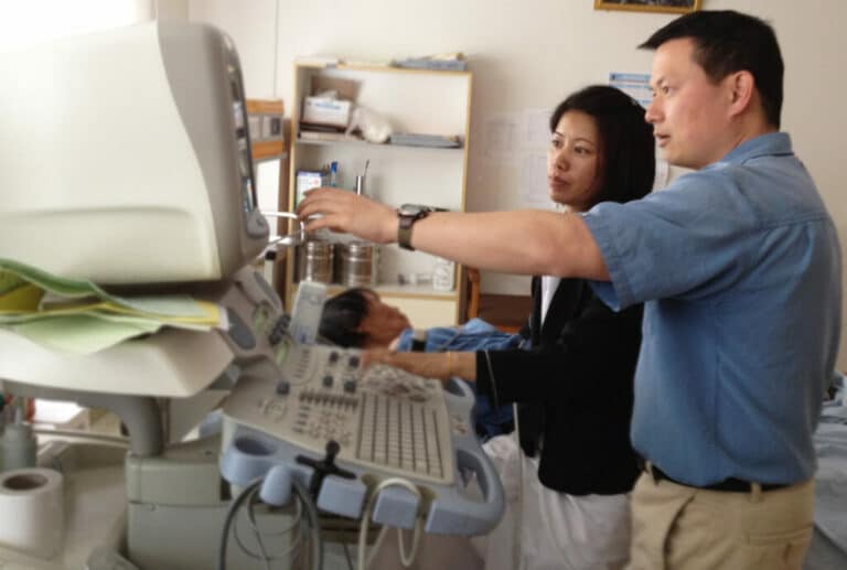 HVO cardiology volunteer assisting a Bhutanese nurse