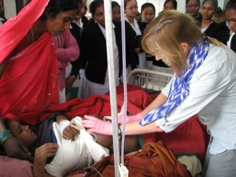 An HVO volunteers shares her expertise in maternal health with nurses in India