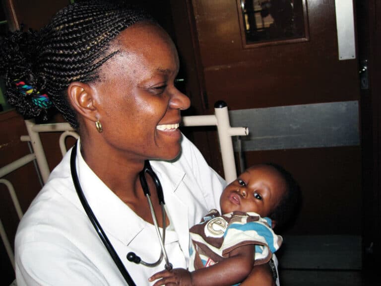 Health worker and her young charge in Uganda